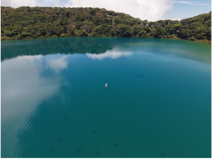 Drone shot of Lago Botos showing a kayak (center) performing water sampling. Photo: Yemerith Alpízar